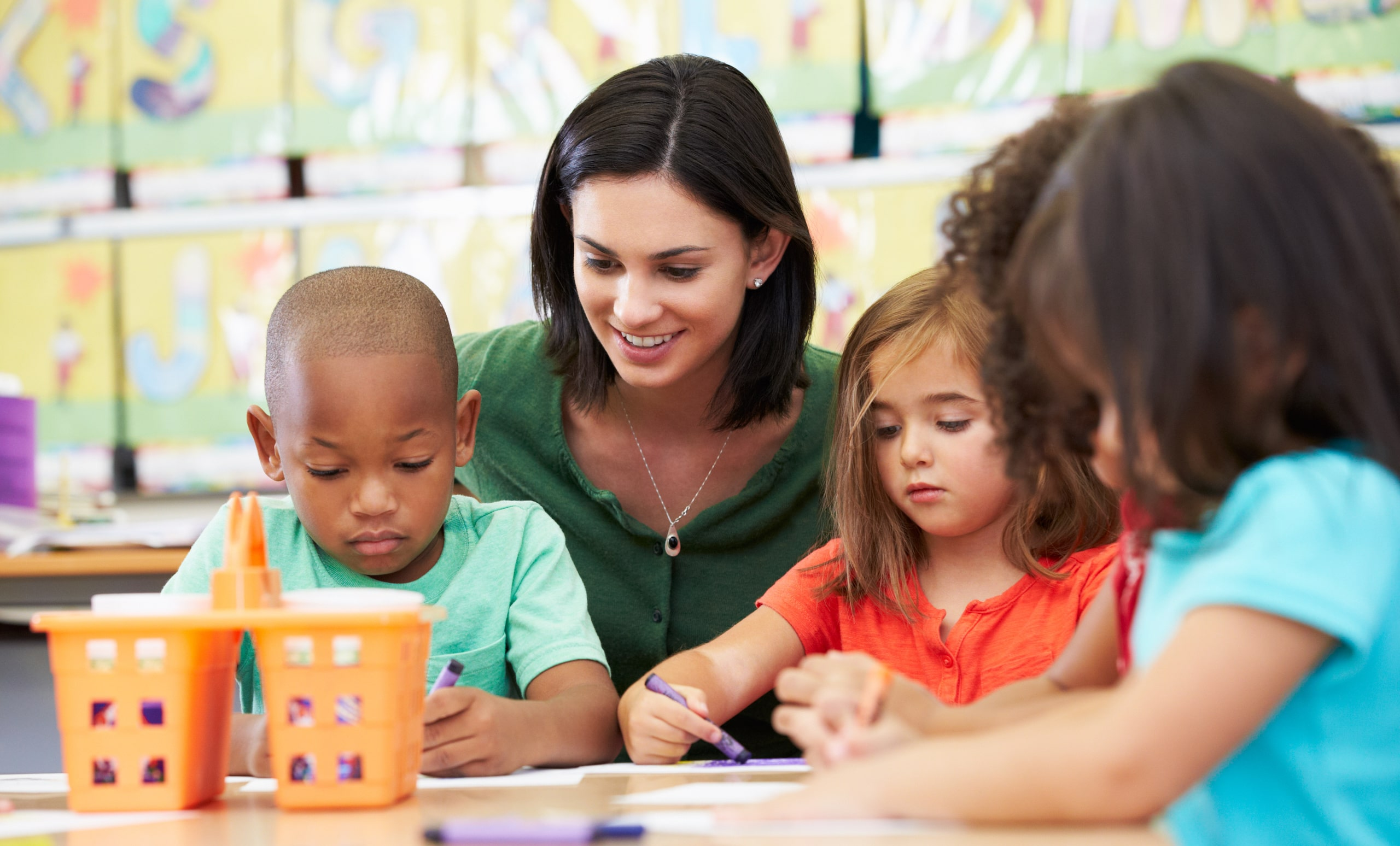 Teacher Looking After Kids - Preschool Curriculum