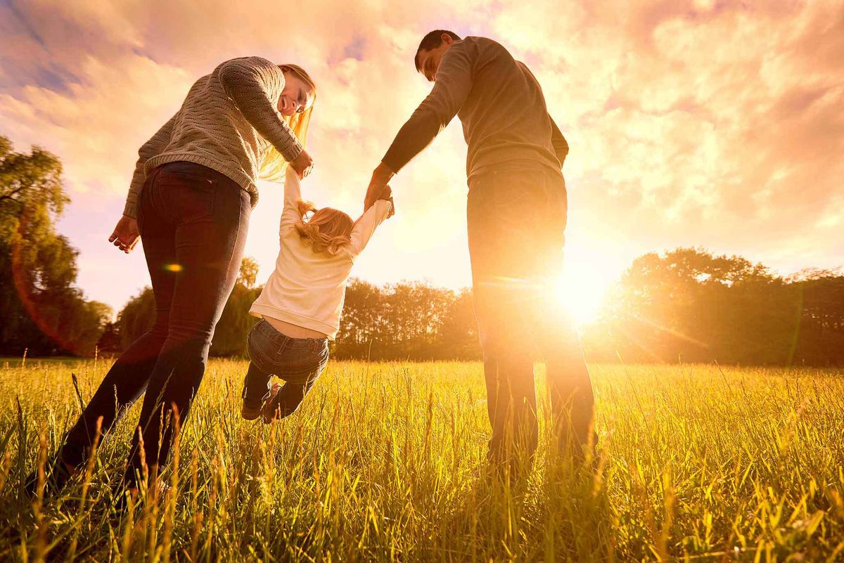 kid in the garden with parents - Styles of Parenting