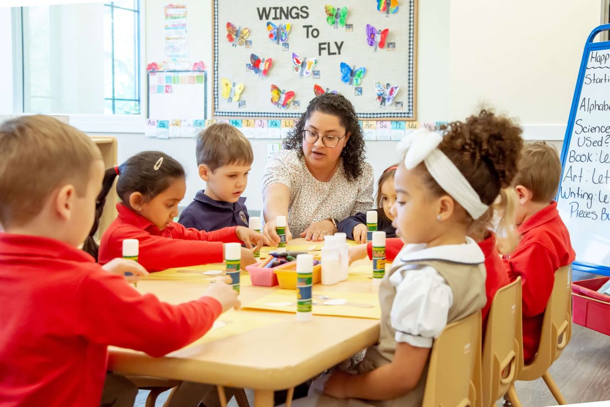 teacher leading the class - What Should a Child Learn in Preschool  