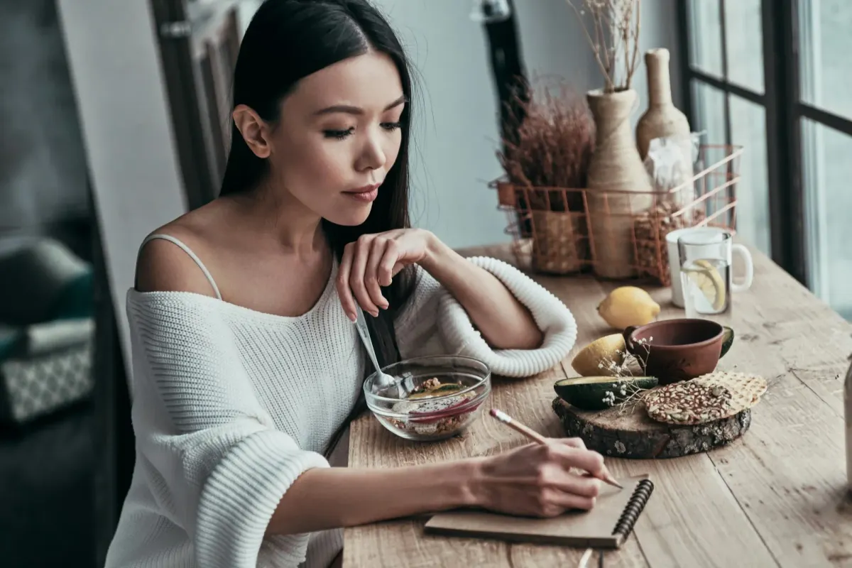 woman writing journal - Creative Hobbies That Improve Mental Clarity