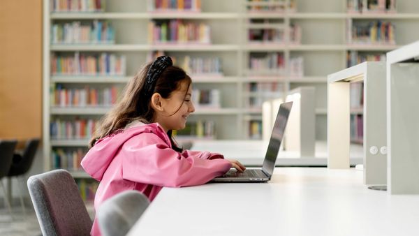 Kid Using Laptop - Best Music Apps for Kids