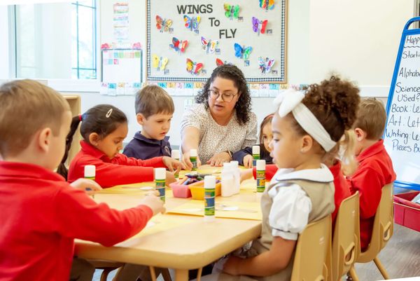teacher leading the class - What Should a Child Learn in Preschool  