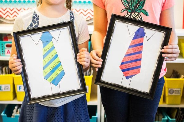Kids Holding Portraits - Father's Day crafts preschool