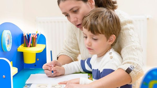 Woman Teaching Kid - Georgia Homeschool Laws