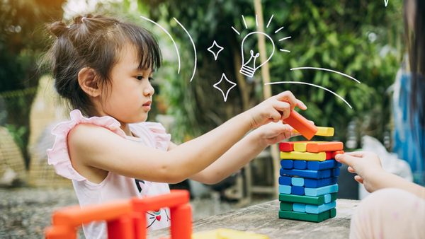 kid playing with jenga - Best Toys For Promoting Creativity 