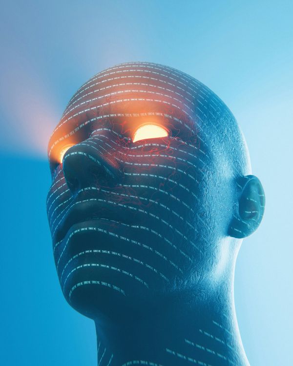 A blueish bald head with gloing eyues and text projected onto it