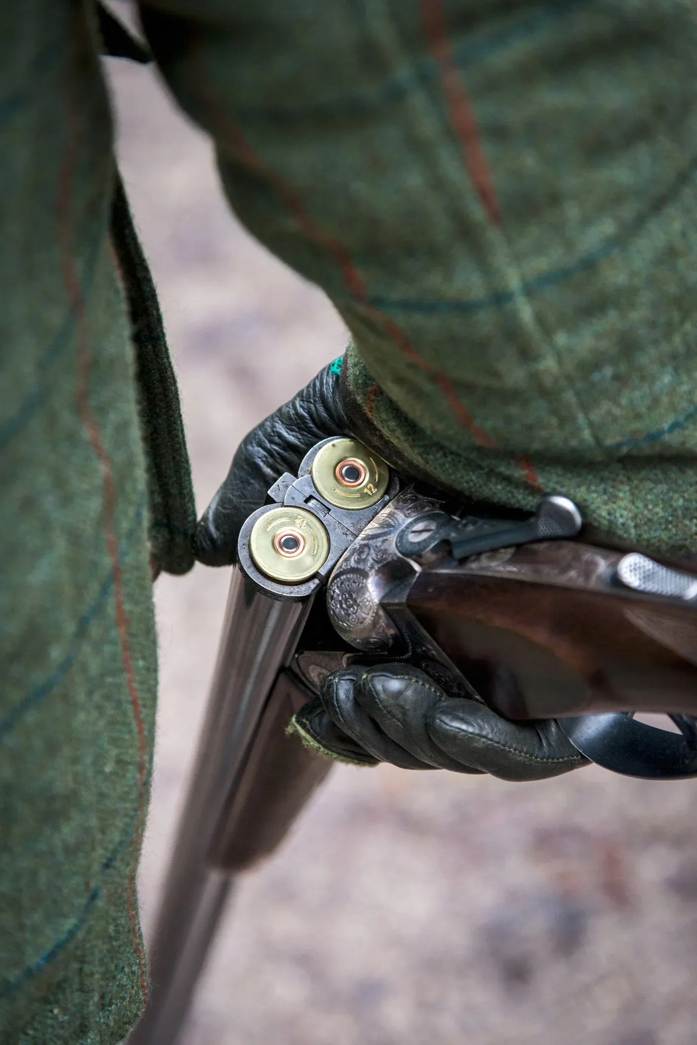 A side-by-side shotgun and tweed