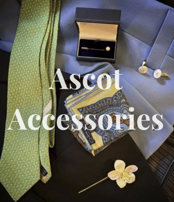 Ascot accessories including green tie, paisley pocket square, cufflinks, stickpin, and pale yellow lapel flower, arranged on a blue jacket, with “Ascot Accessories” text overlay.