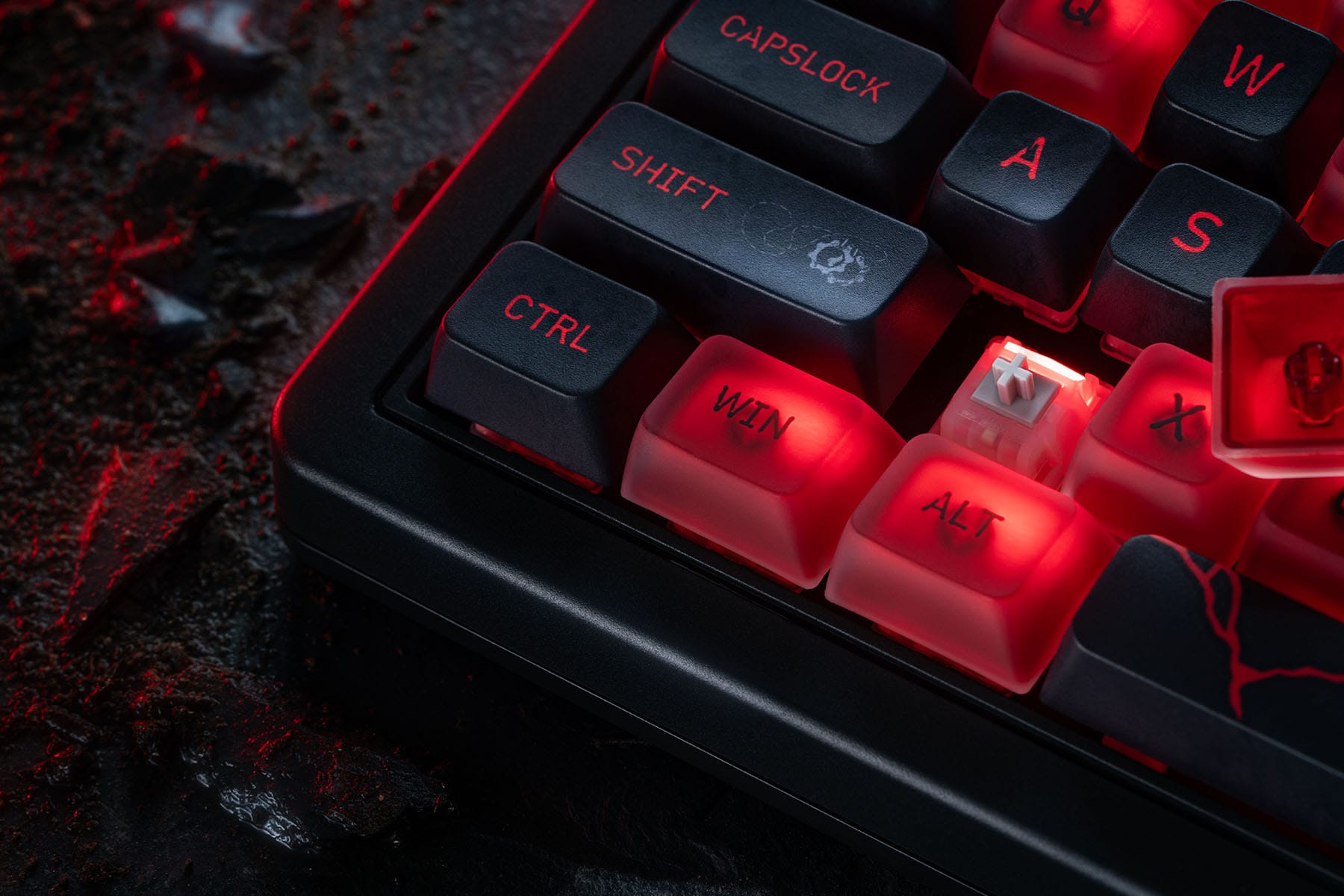 Close-up of the keyboard corner with a keycap removed to show a switch