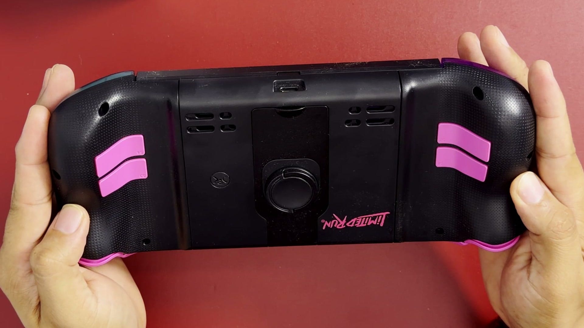 Back of the CRKD Nitro Deck 2 Limited Run edition with four pink rear buttons