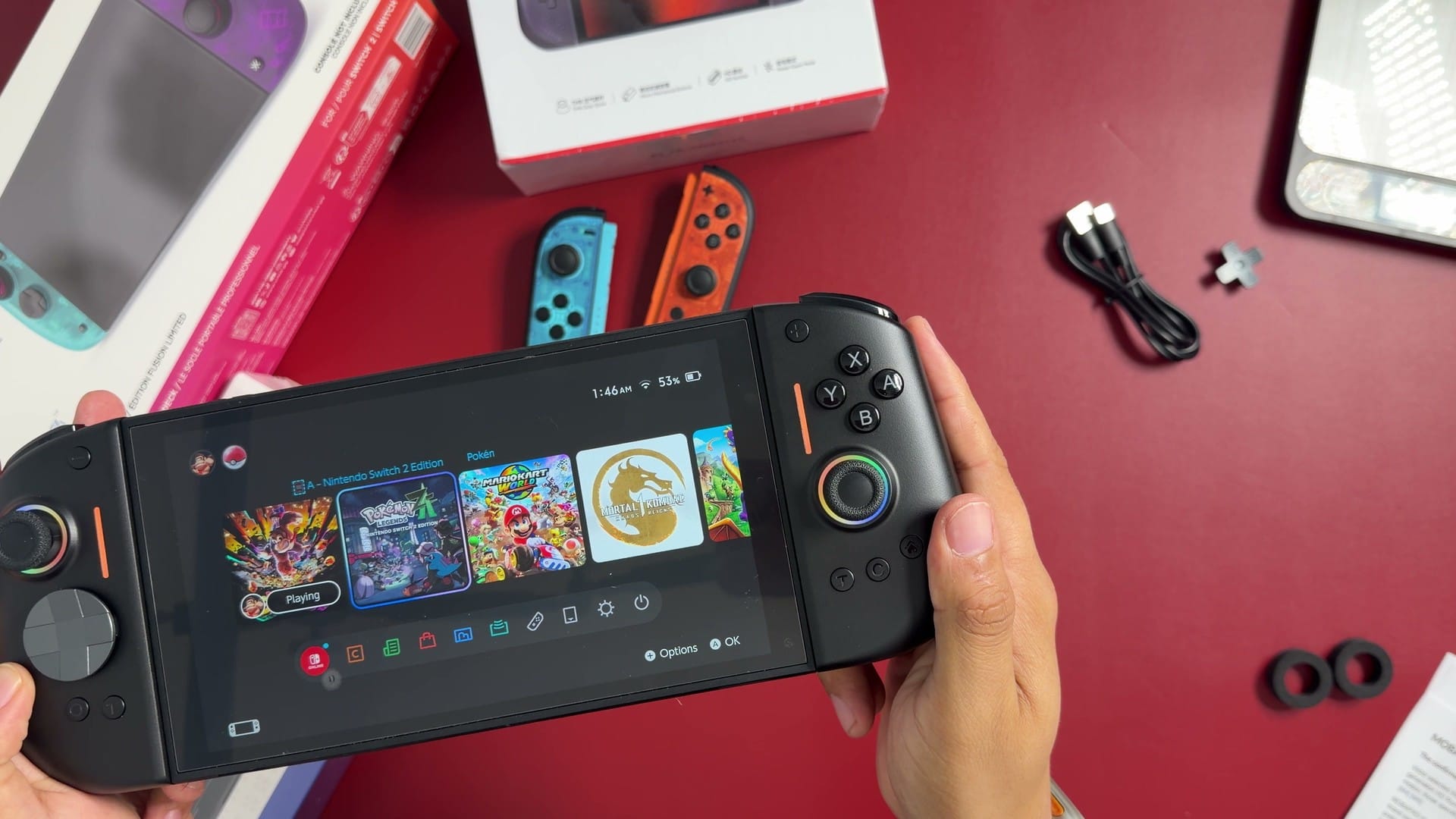 NYXI Hyperion 3 controllers attached to a Nintendo Switch 2 showing the home screen