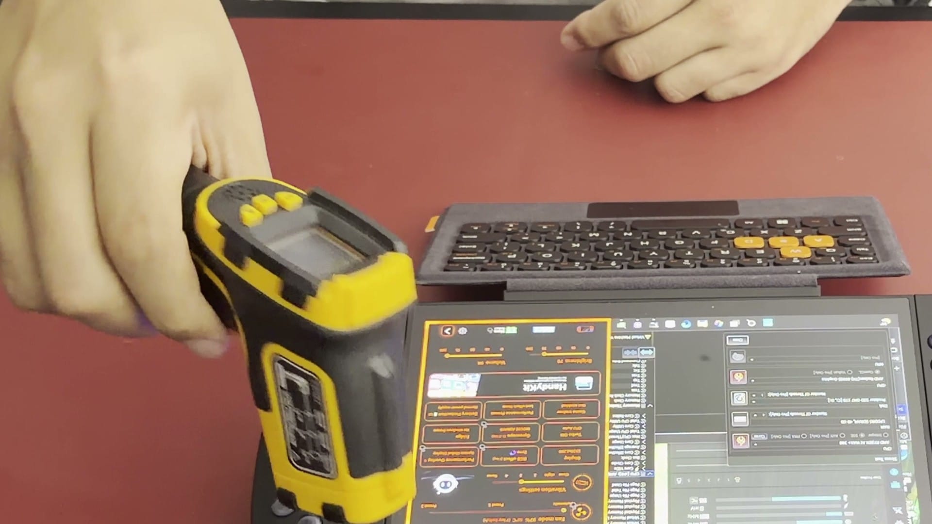 Infrared thermometer aimed at the X2 Mini Pro during the stress test