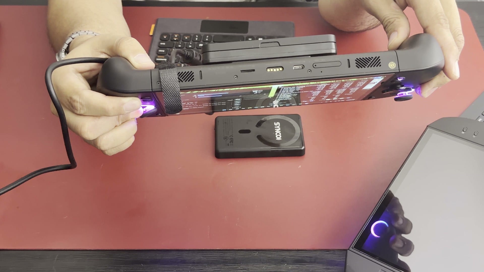 Top edge of the OneXPlayer X2 Mini Pro held up to show its ports
