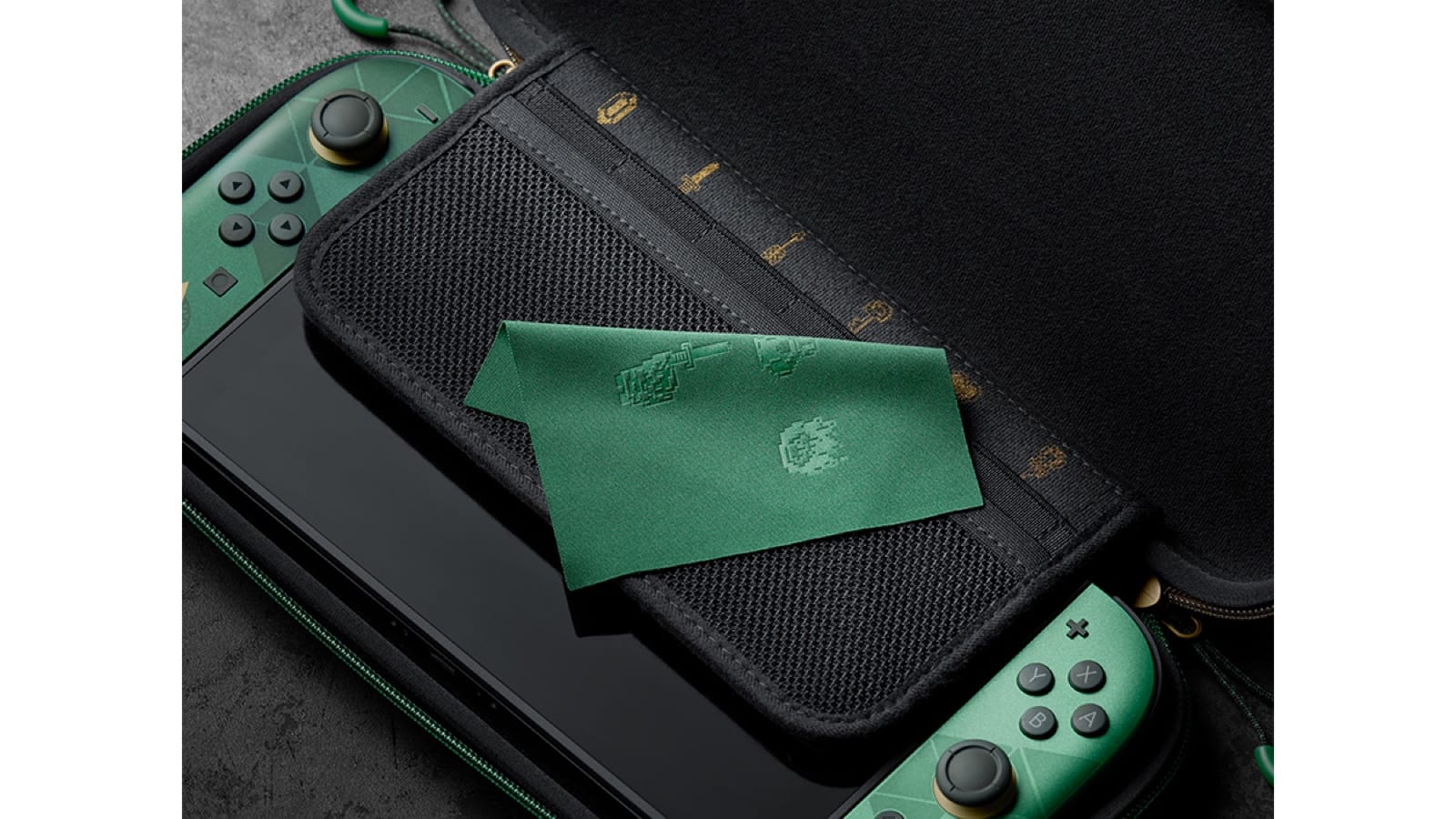 The Zelda 40th Anniversary carrying case open with a Switch 2 inside and a green cloth