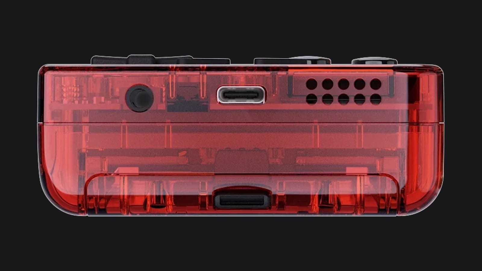 The bottom edge of the transparent red Chromatic with headphone jack, USB-C port and speaker grille
