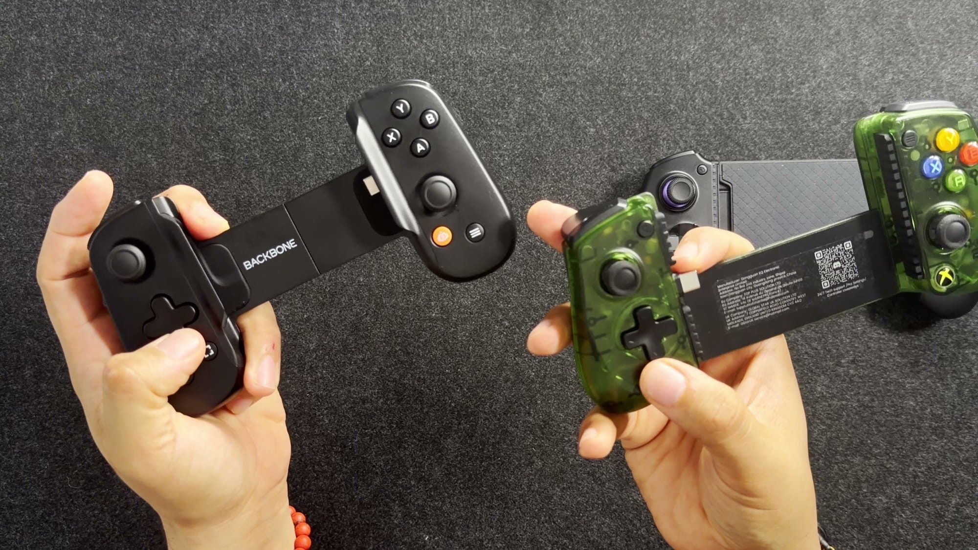 Backbone One and GameSir X5 Lite D-pads side by side in hand