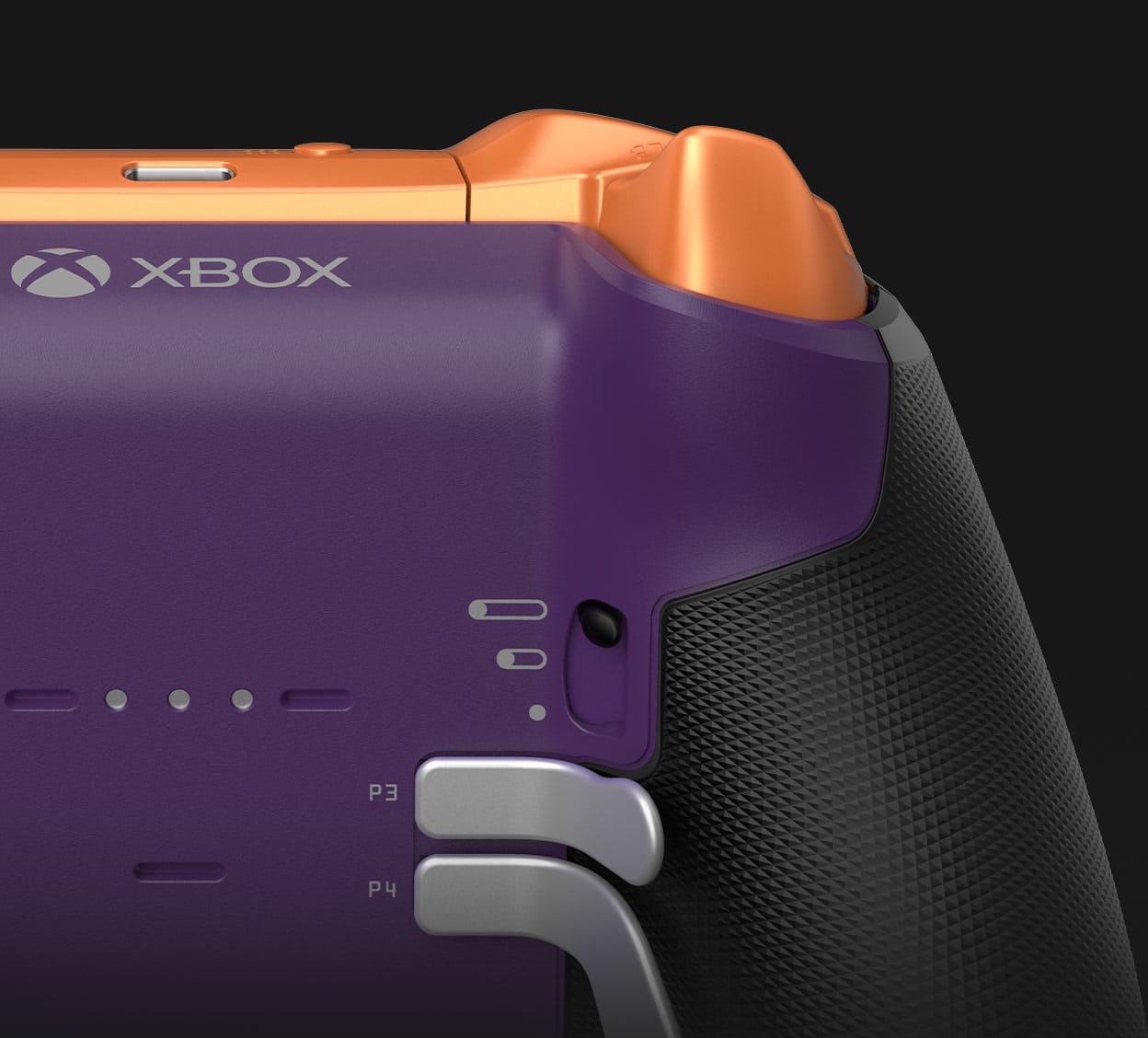The back of a purple and orange Xbox Elite Series 2 controller showing its metal paddles and trigger locks