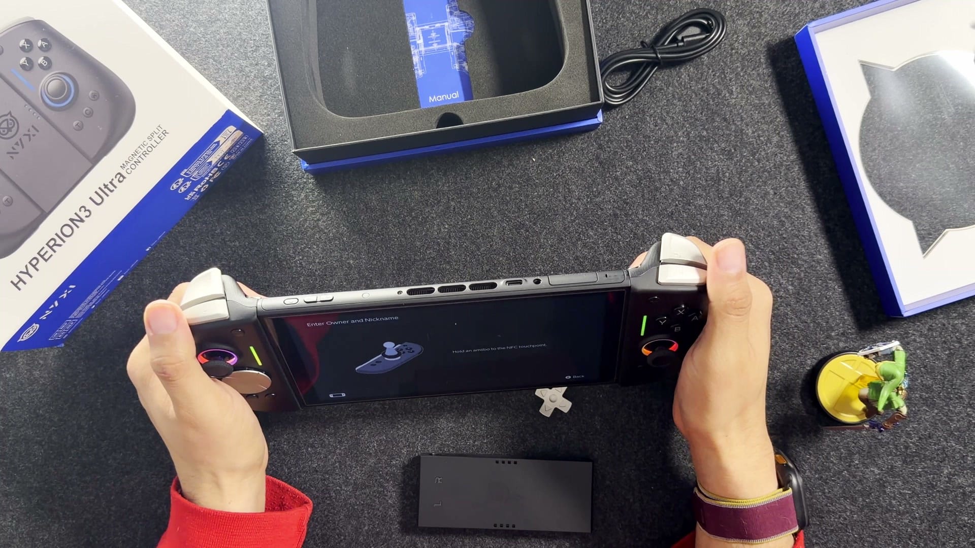 The top edge of the Switch 2 with the Ultra's silver shoulder button