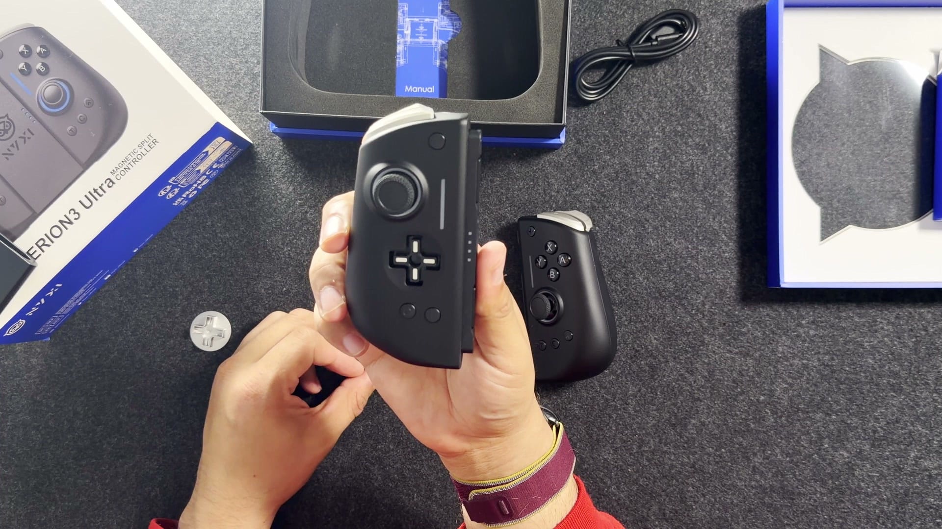 The Hyperion 3 Ultra left half with its magnetic metal D-pad lifted off