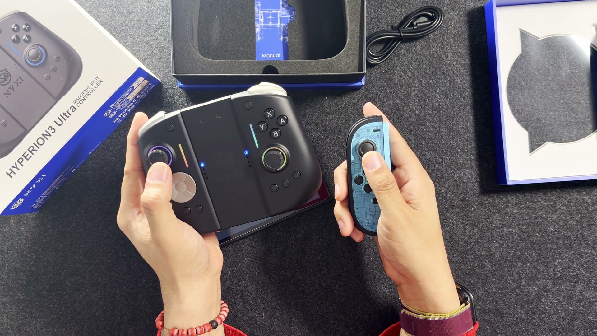 The Hyperion 3 Ultra in its bridge next to a Joy-Con 2
