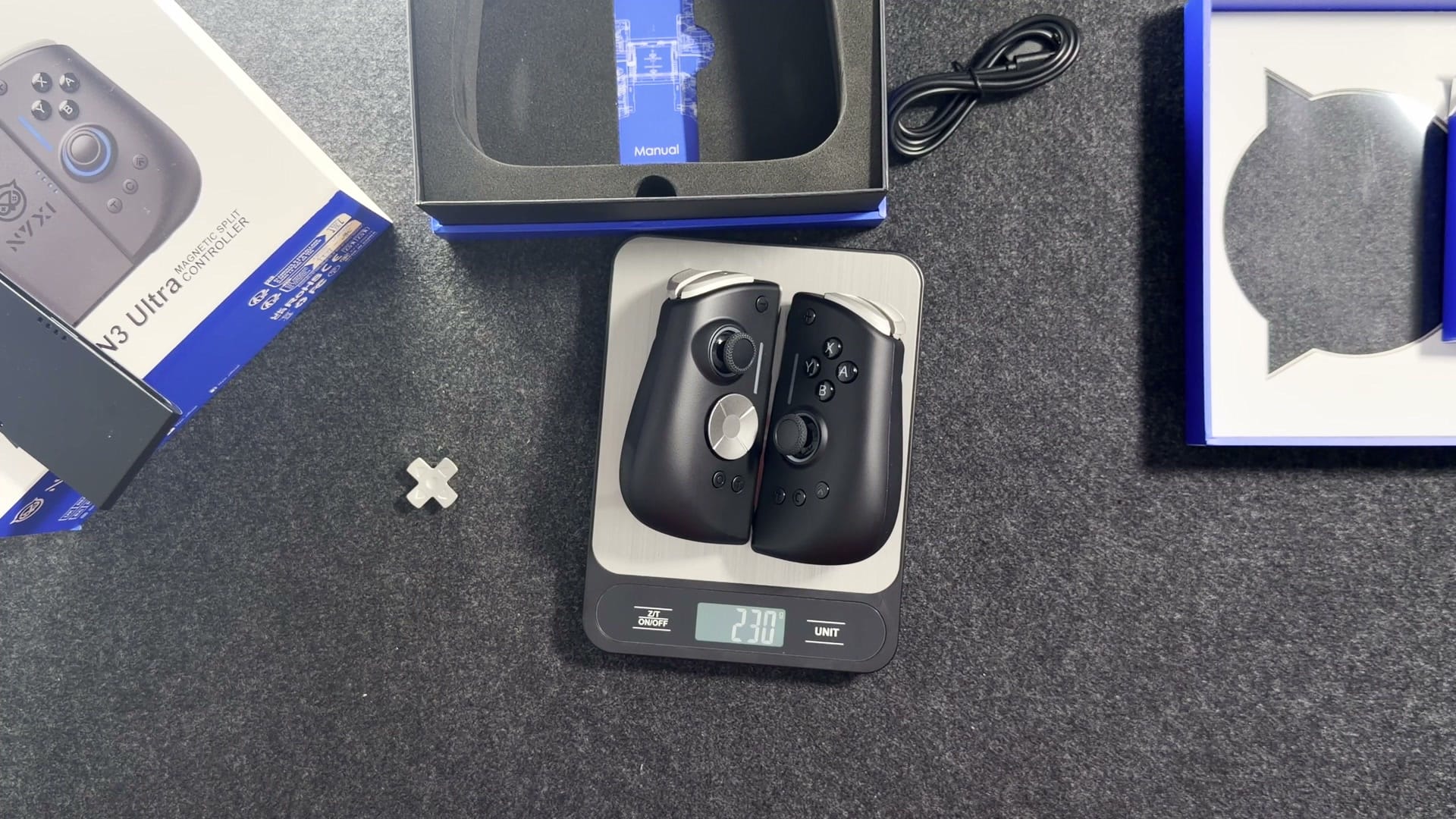 The Hyperion 3 Ultra pair on a kitchen scale reading 230 grams