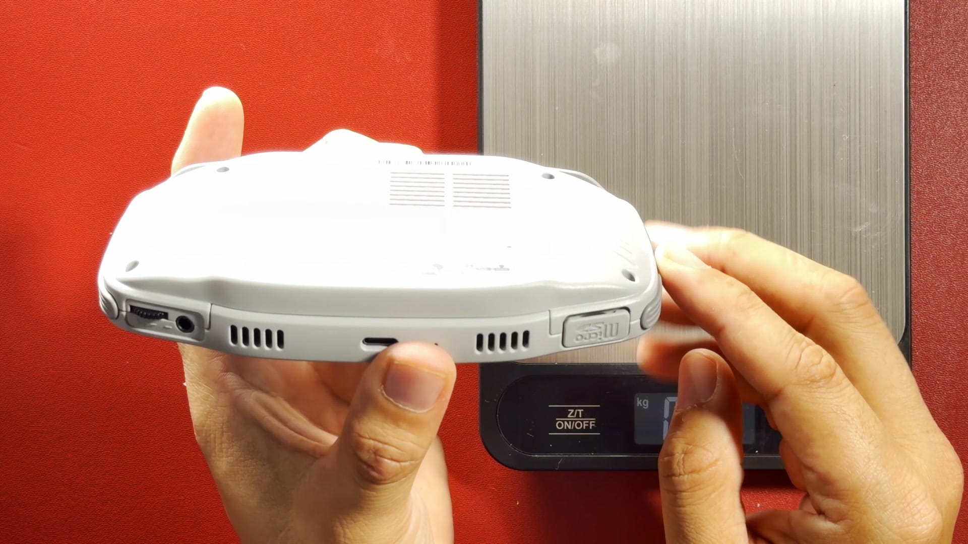 The bottom edge of the KONKR Pocket Advance with headphone jack, speaker grilles and USB-C port