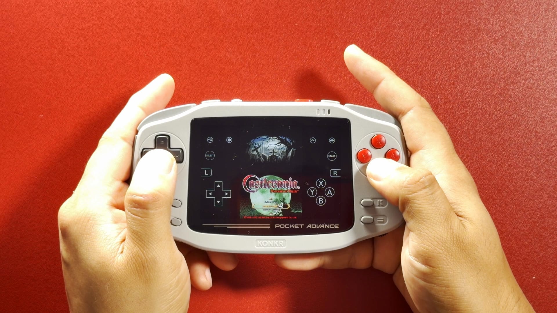 Castlevania: Portrait of Ruin running on the KONKR Pocket Advance with touch controls on screen
