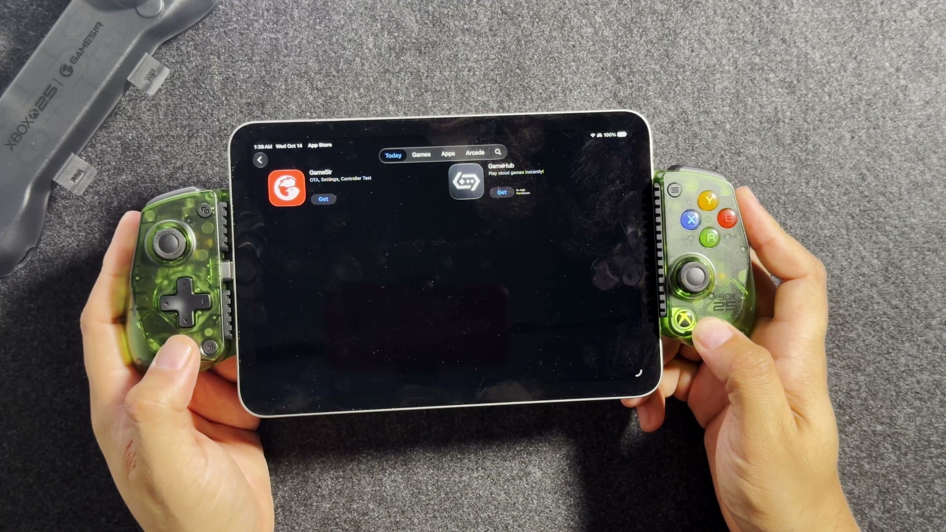 An iPad mini held in the GameSir X5 Lite, showing the App Store
