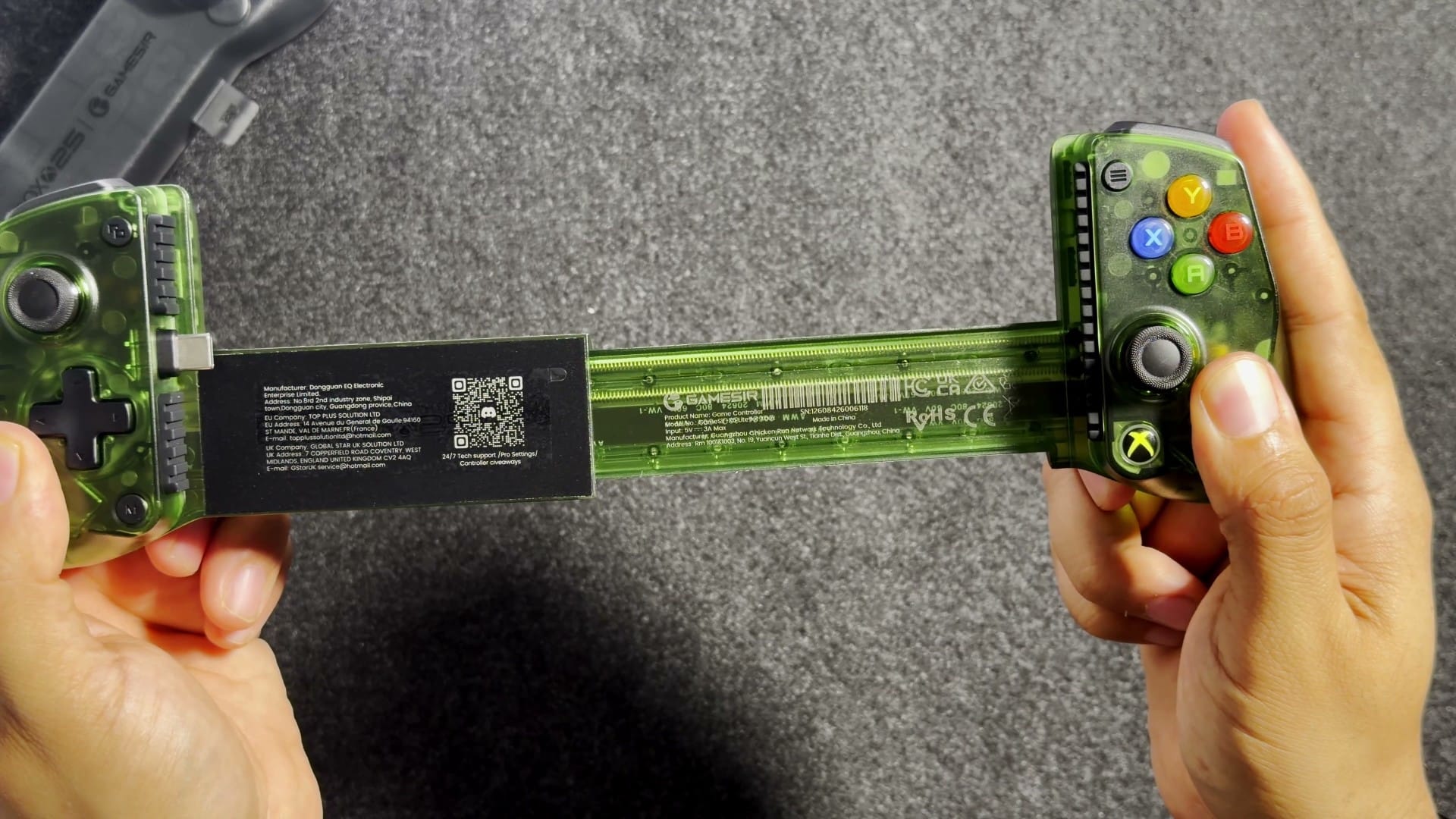 The GameSir X5 Lite pulled out to full width between two hands