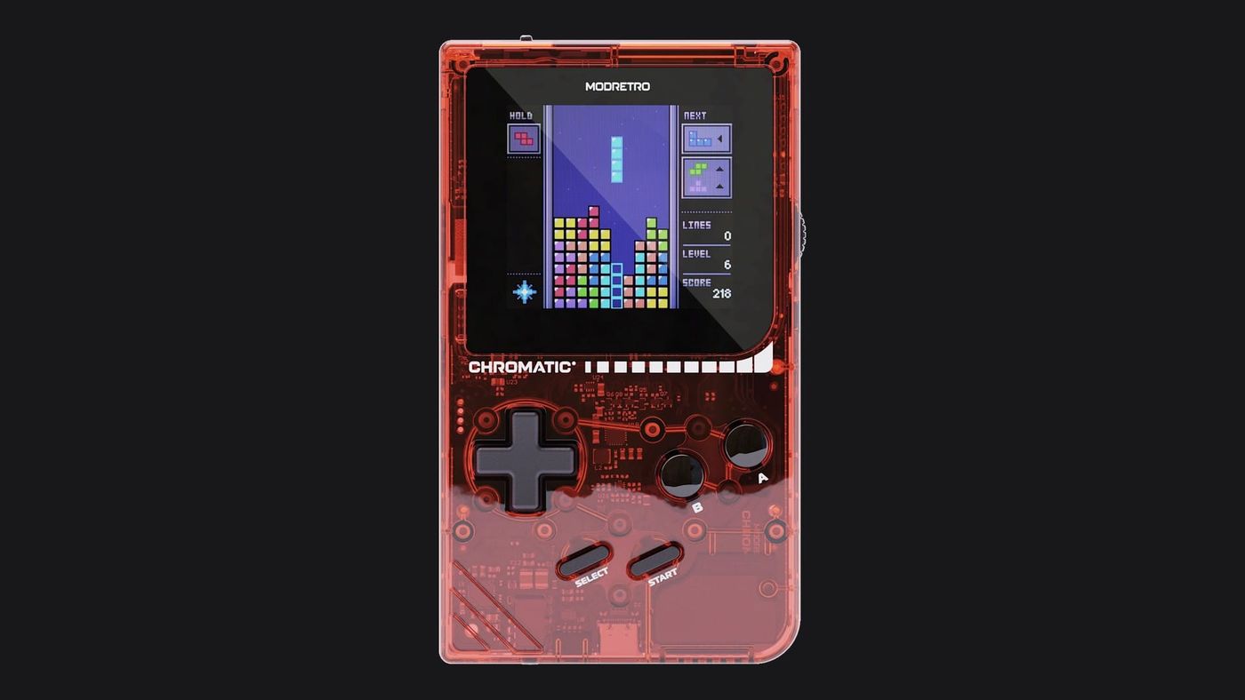 The transparent red ModRetro Chromatic handheld running Tetris, on a dark background