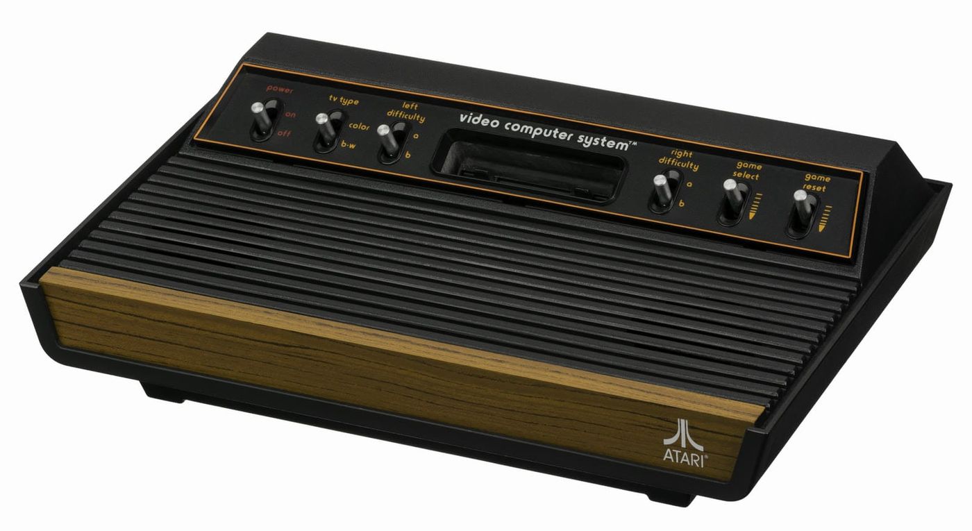 Atari 2600 "Heavy Sixer" with woodgrain front, six switches