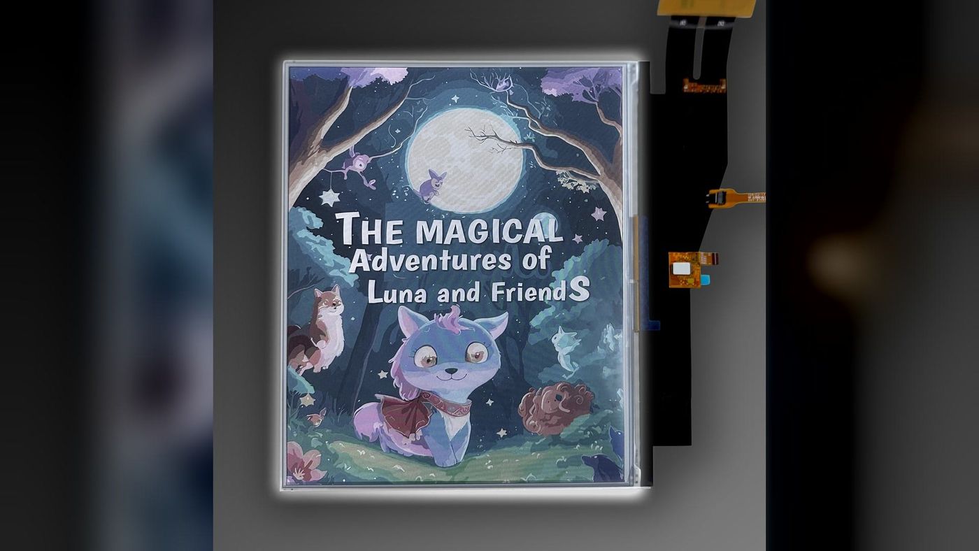 A bare E Ink Kaleido 4 colour display panel showing an illustrated book cover, with its ribbon cables beside it