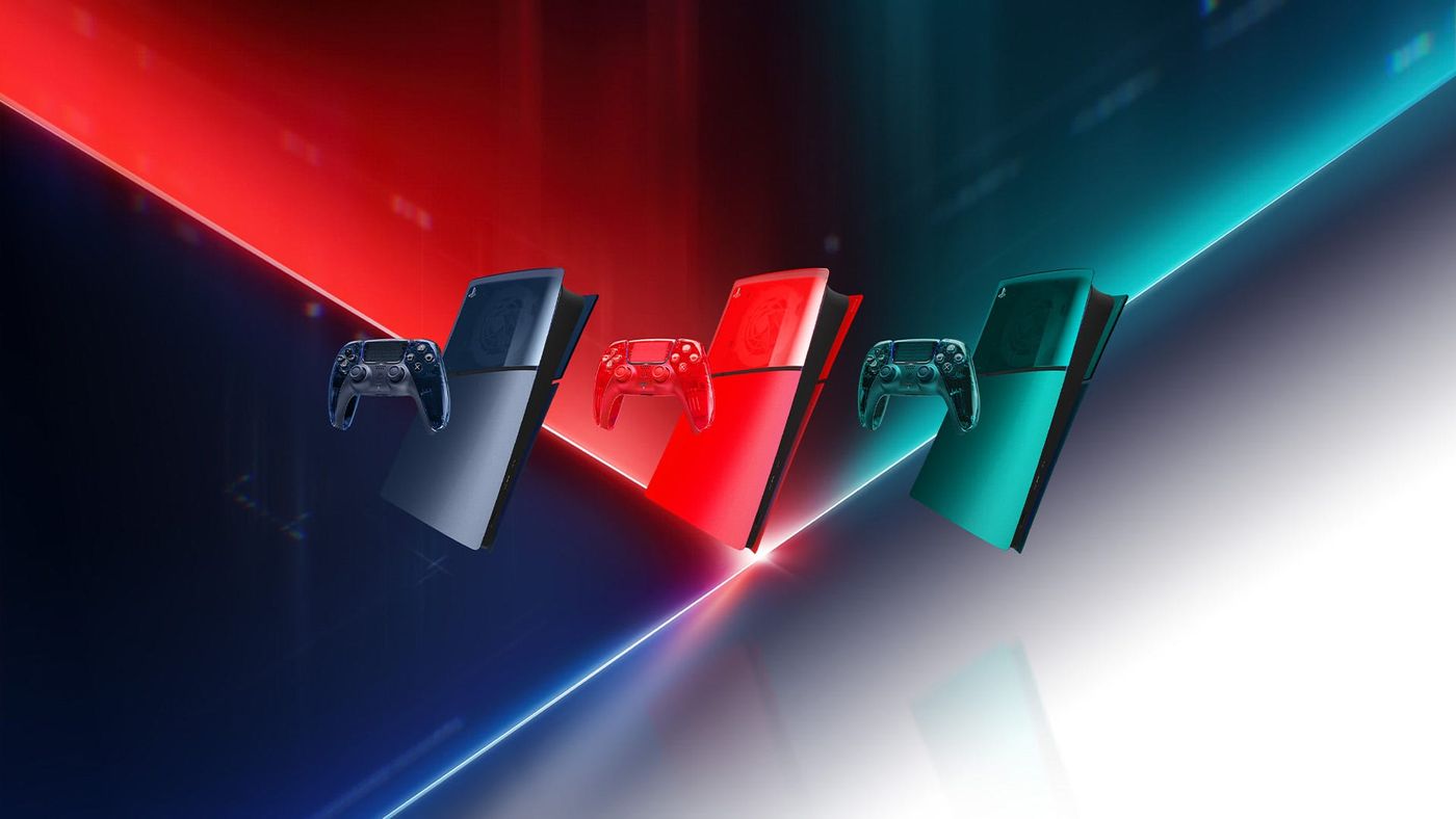 Three Prism Collection DualSense controllers in Graphite Gray, Flare Orange and Emerald Green beside three PS5 consoles in matching see-through covers
