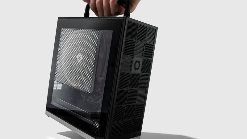 Framework Desktop mini PC carried by its handle, with a translucent side panel