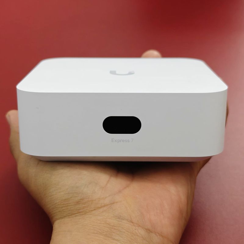 Victor holding his white UniFi Express 7