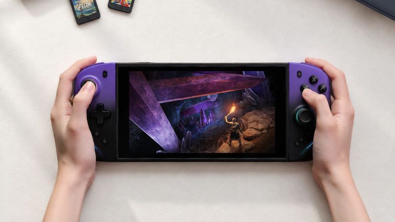 Hands holding a Nintendo Switch 2 with purple Mobapad M12 Pro controllers attached