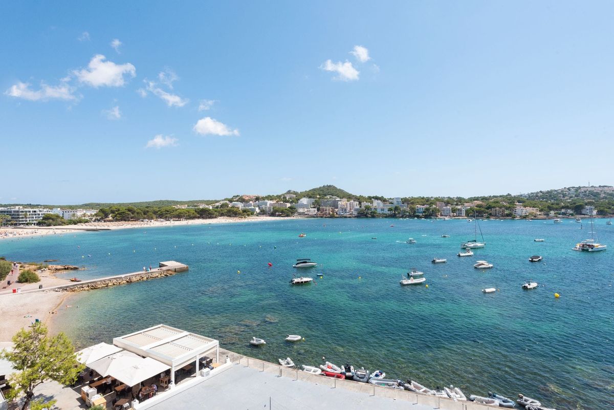 Santa Ponsa bay, beach and moored boats — a sought-after area to buy property in Southwest Mallorca