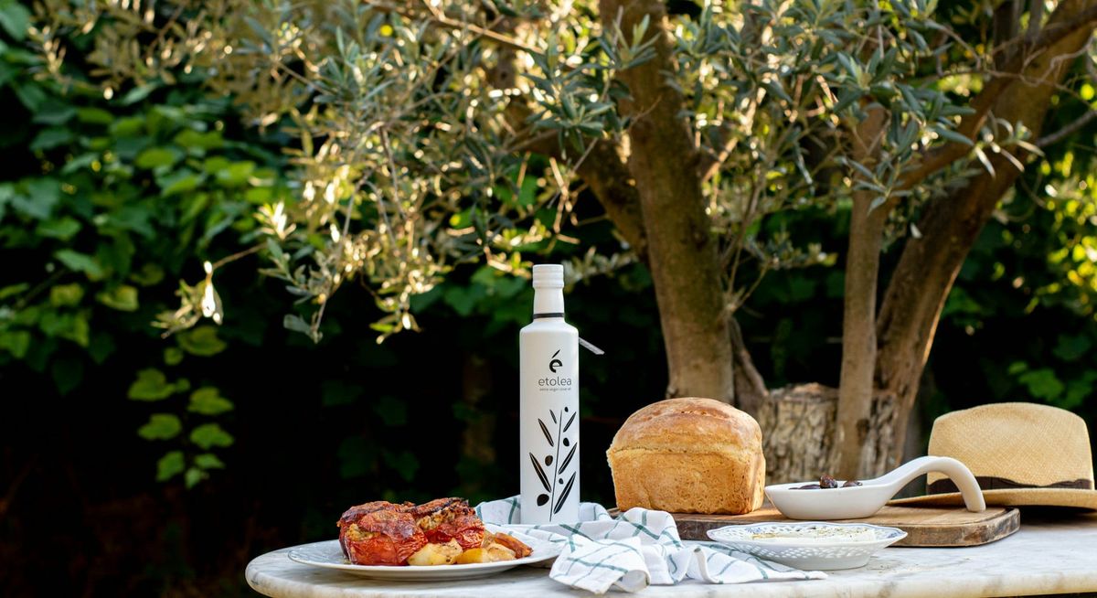 A Mediterranean summer table set with bread and olive oil