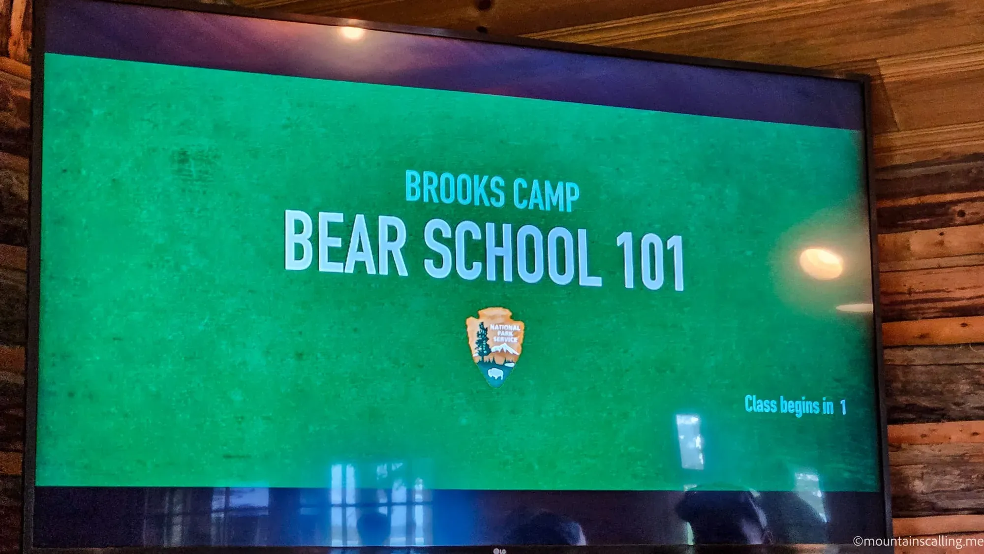 Brooks Camp Bear School 101 presentation screen at Katmai National Park visitor center with National Park Service logo