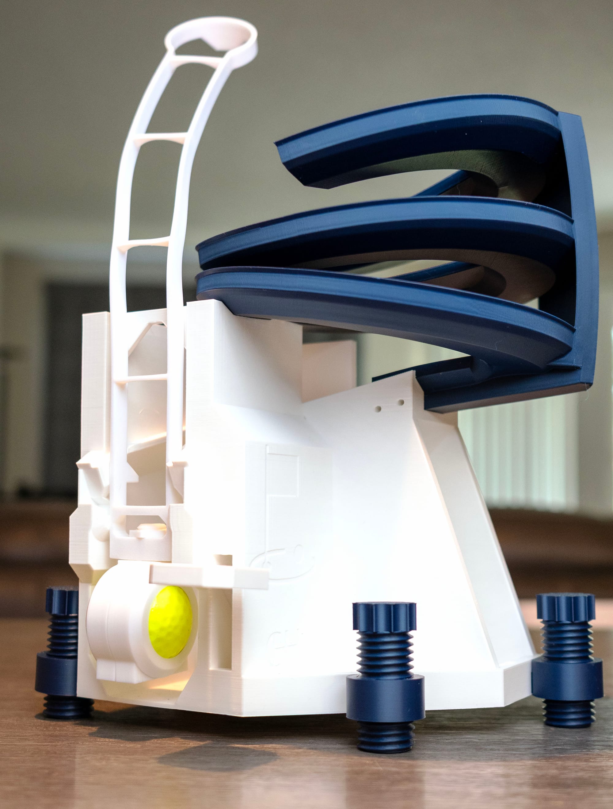 Warped PLA golf ball dispenser ramp