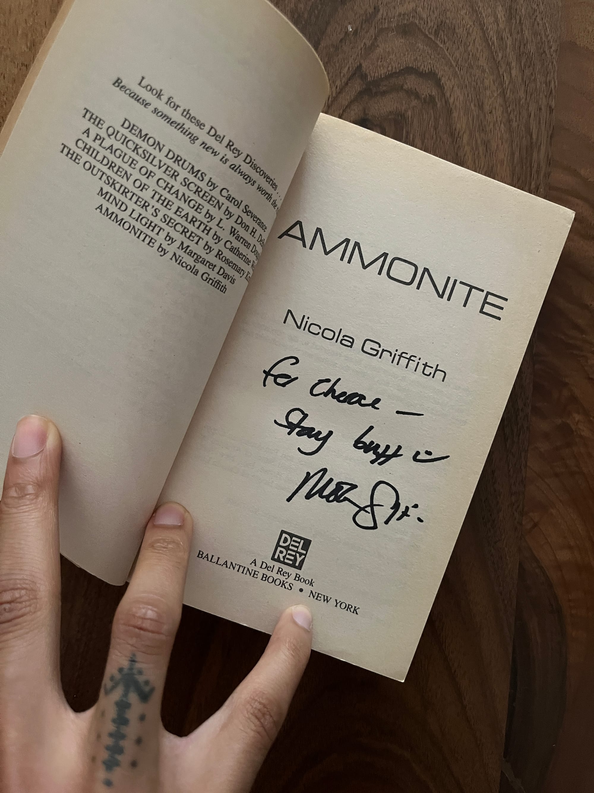 signed copy of ammonite by nicola griffith inscribed “for cherae—stay buff :)”