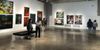 A photo of attendees at an evening art exhibit at the RAM