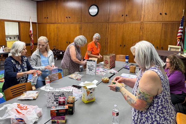 Zonta Club Volunteers Pack Care Bags for Meals on Wheels Seniors