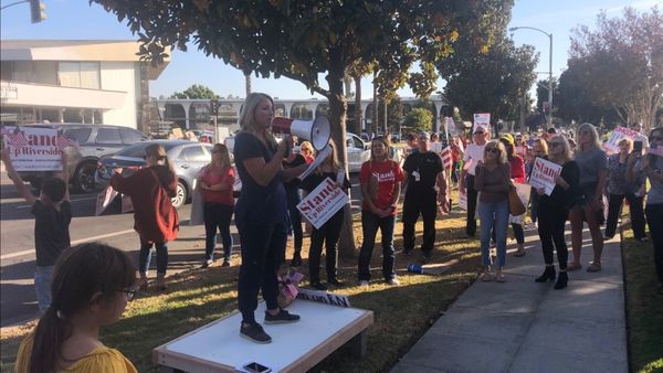 A picture of a Stand Up Riverside rally outside the RUSD school board meeting.