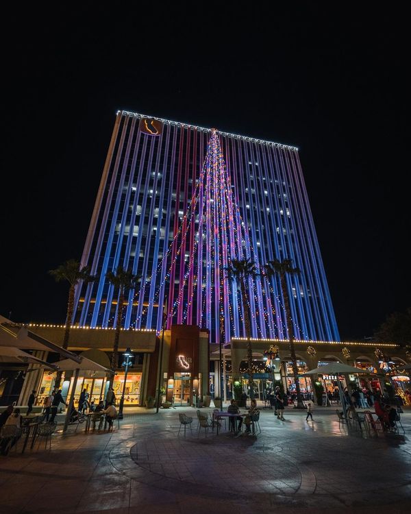 A photo of a nighttime light display of Downtown Riverside building.