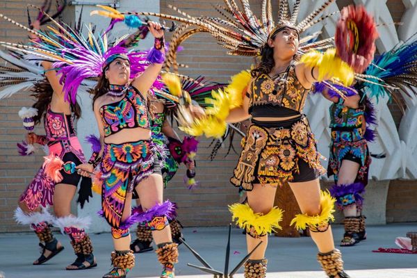 Members of Ballet Folklorico de Riverside perform an Aztec dance at The Cheech museum opening.