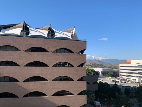 City Hall against the snow capped mountains