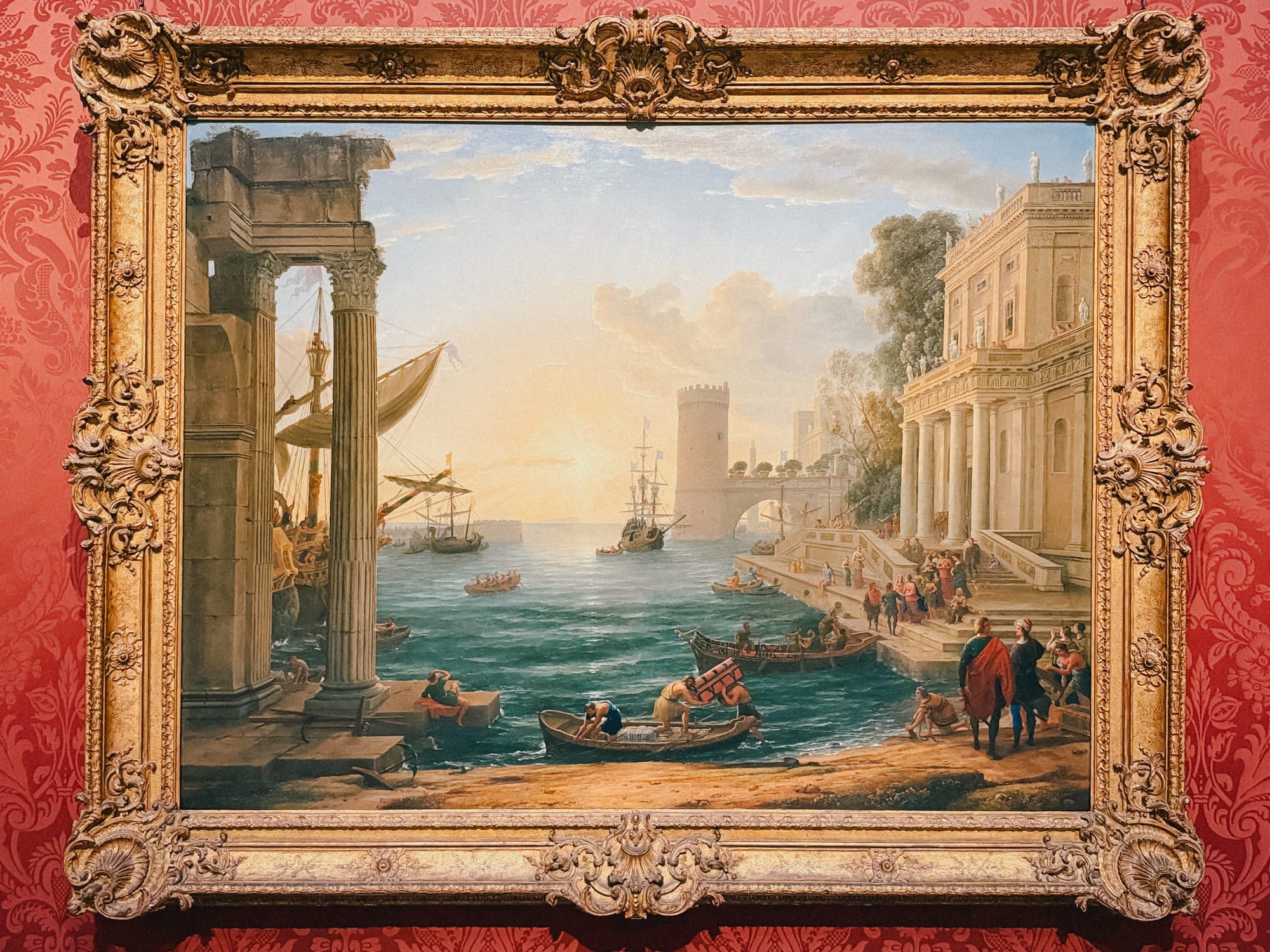 A seaport at sunset by Claude