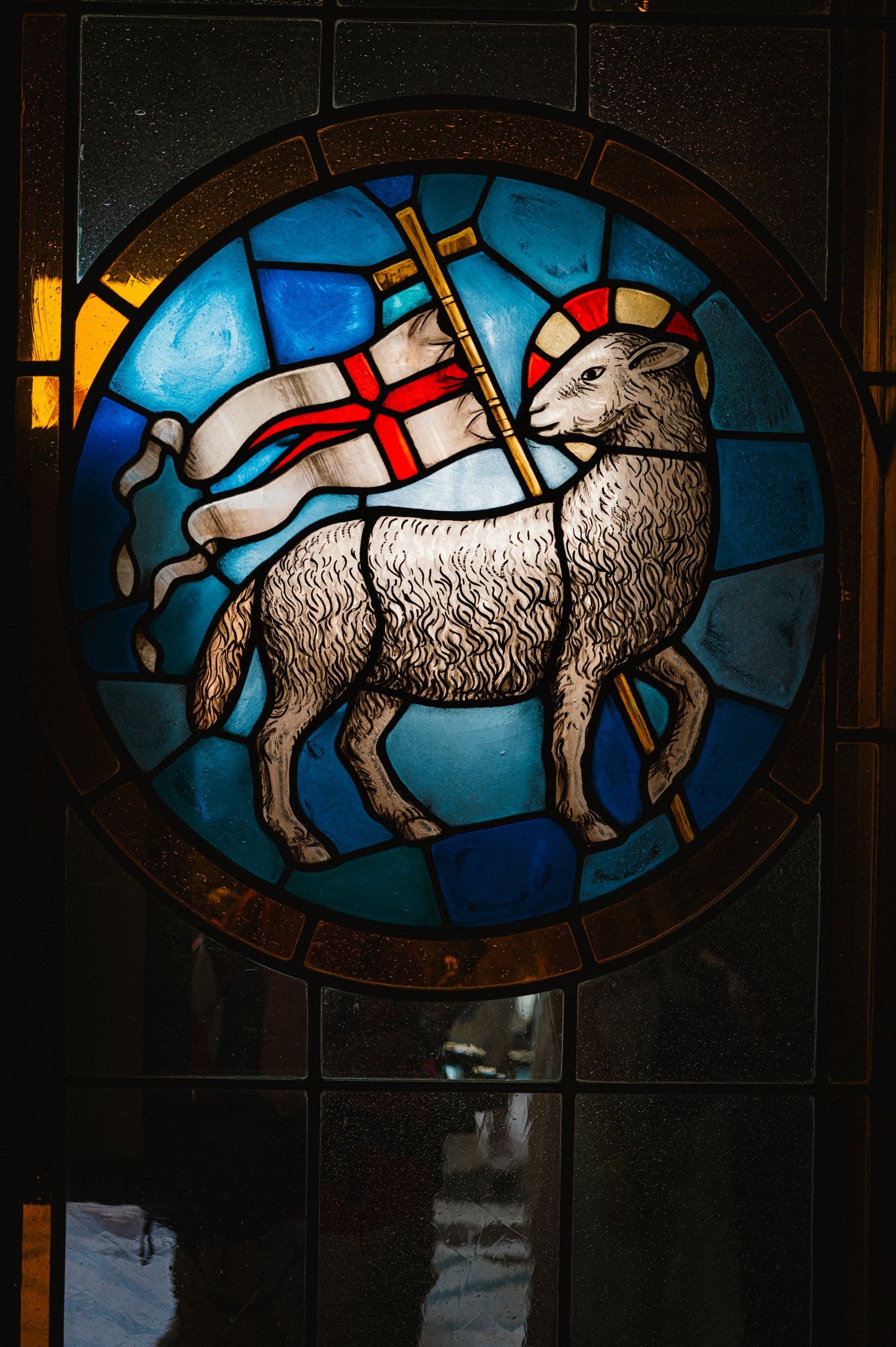 A stained-glass roundel of the Lamb