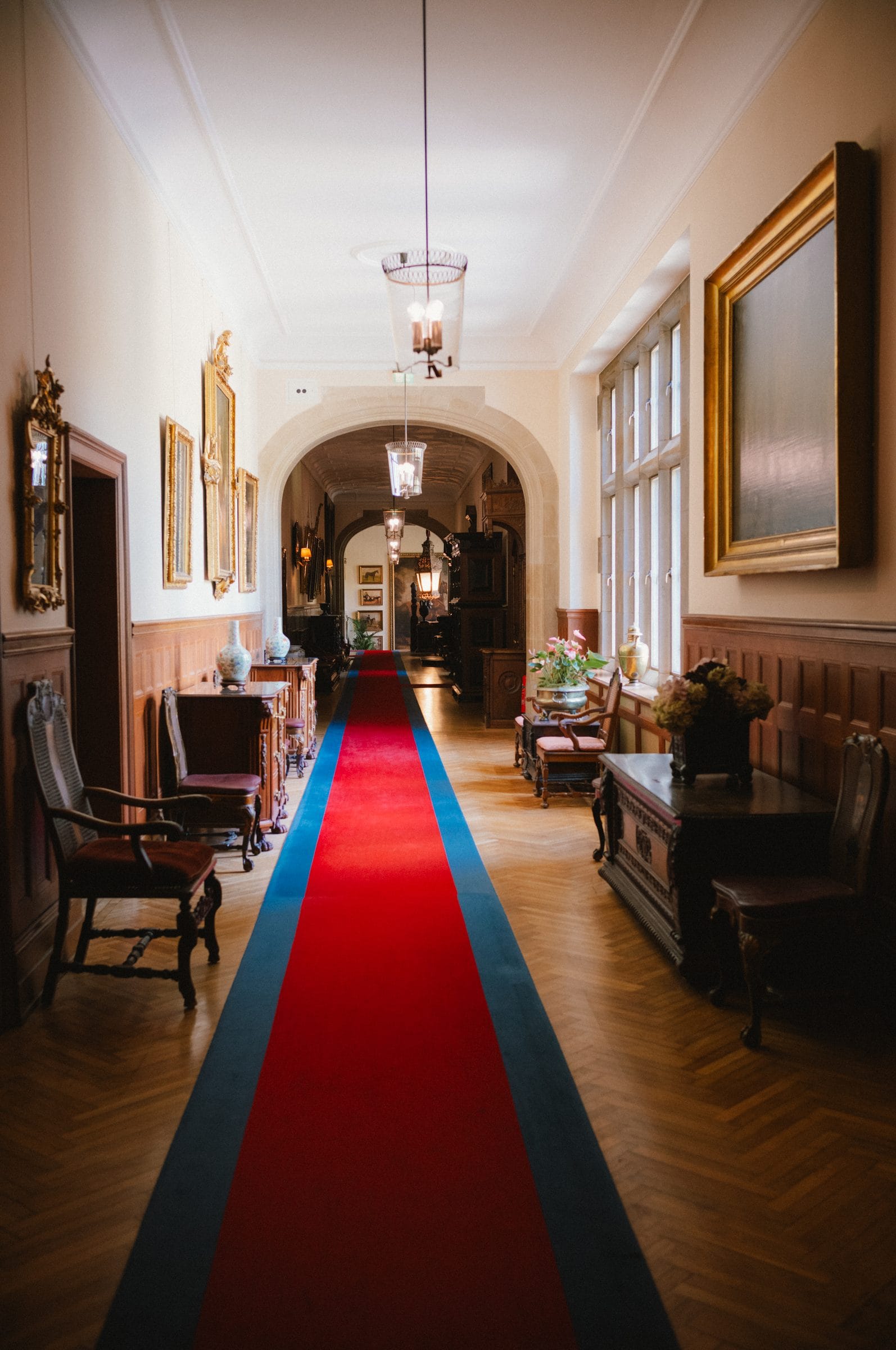 A corridor with a red runner